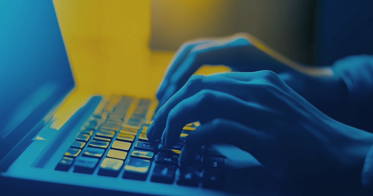 A court reporter's hands as they type on their stenography machine.
